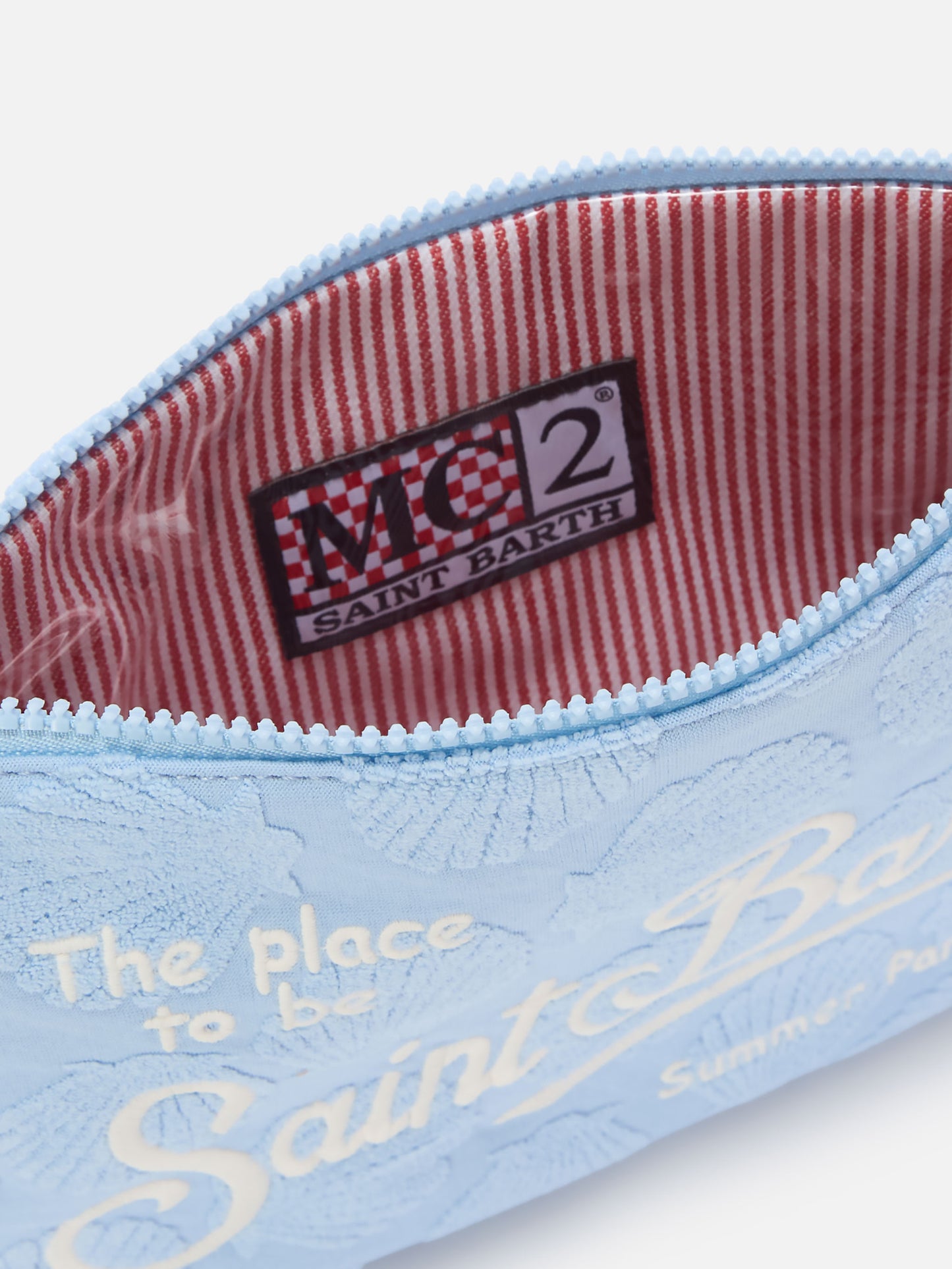 Parisienne Sponge terry-effect pouch with embossed shell pattern and removable strap