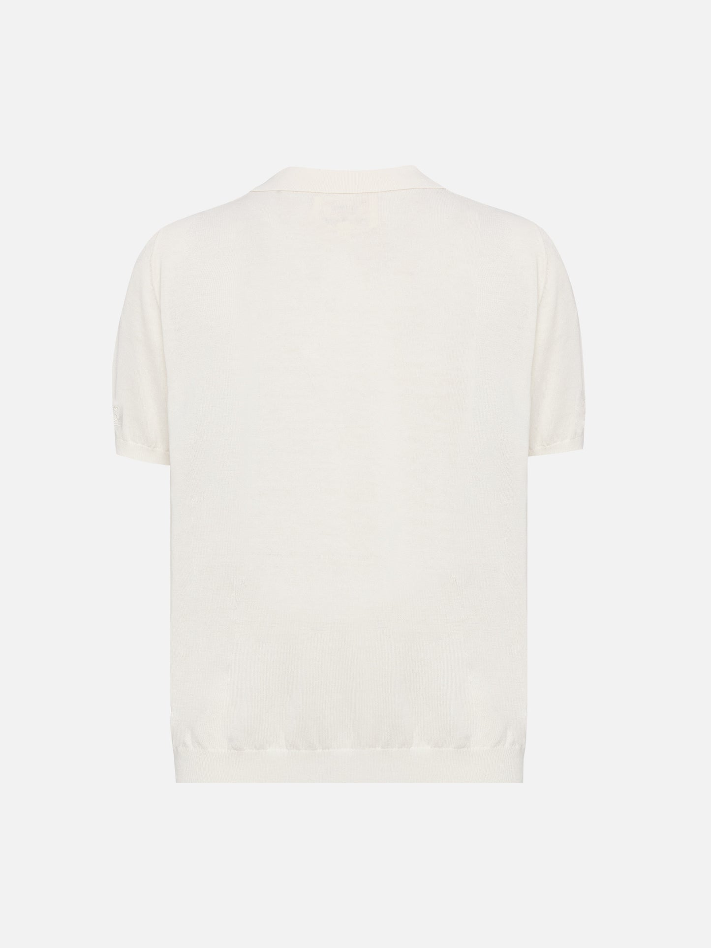 Polo Sloan Jr in maglia bianca
