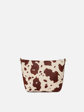 Aline Tasche aus Ponyfell mit Kuhmuster und Metall-Logoplakette 