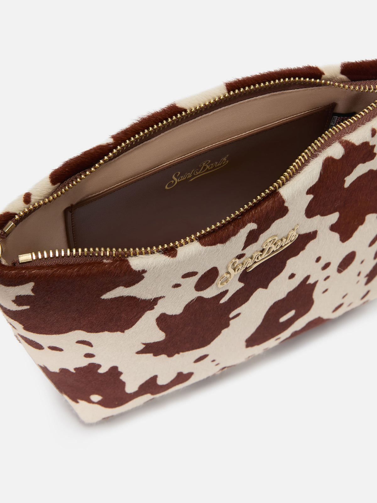 Aline Tasche aus Ponyfell mit Kuhmuster und Metall-Logoplakette 