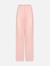 Pantaloni ampi Amalia in georgette rosa con strass