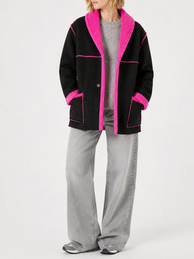 Black and fluo pink Dorys reversible shearling coat