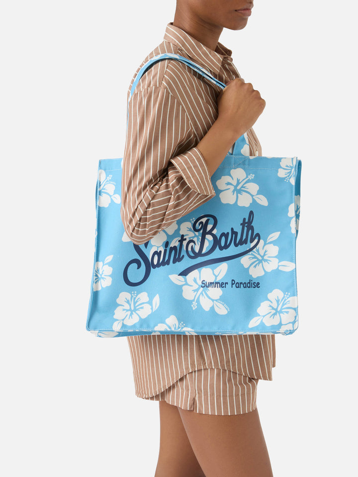Essential canvas tote bag with light blue hibiscus print and contrasting logo