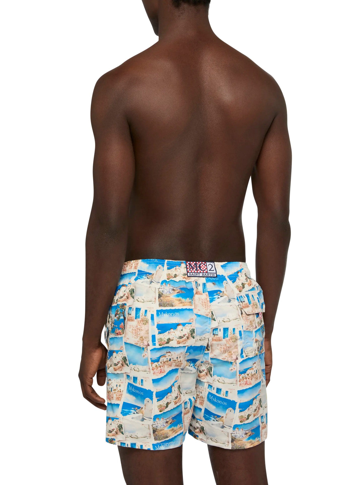 Mid-length Gustavia swim-shorts with Mykonos postcard print | AI CO-CREATED DESIGN BY RICKDICK - POWERED BY RED-EYE