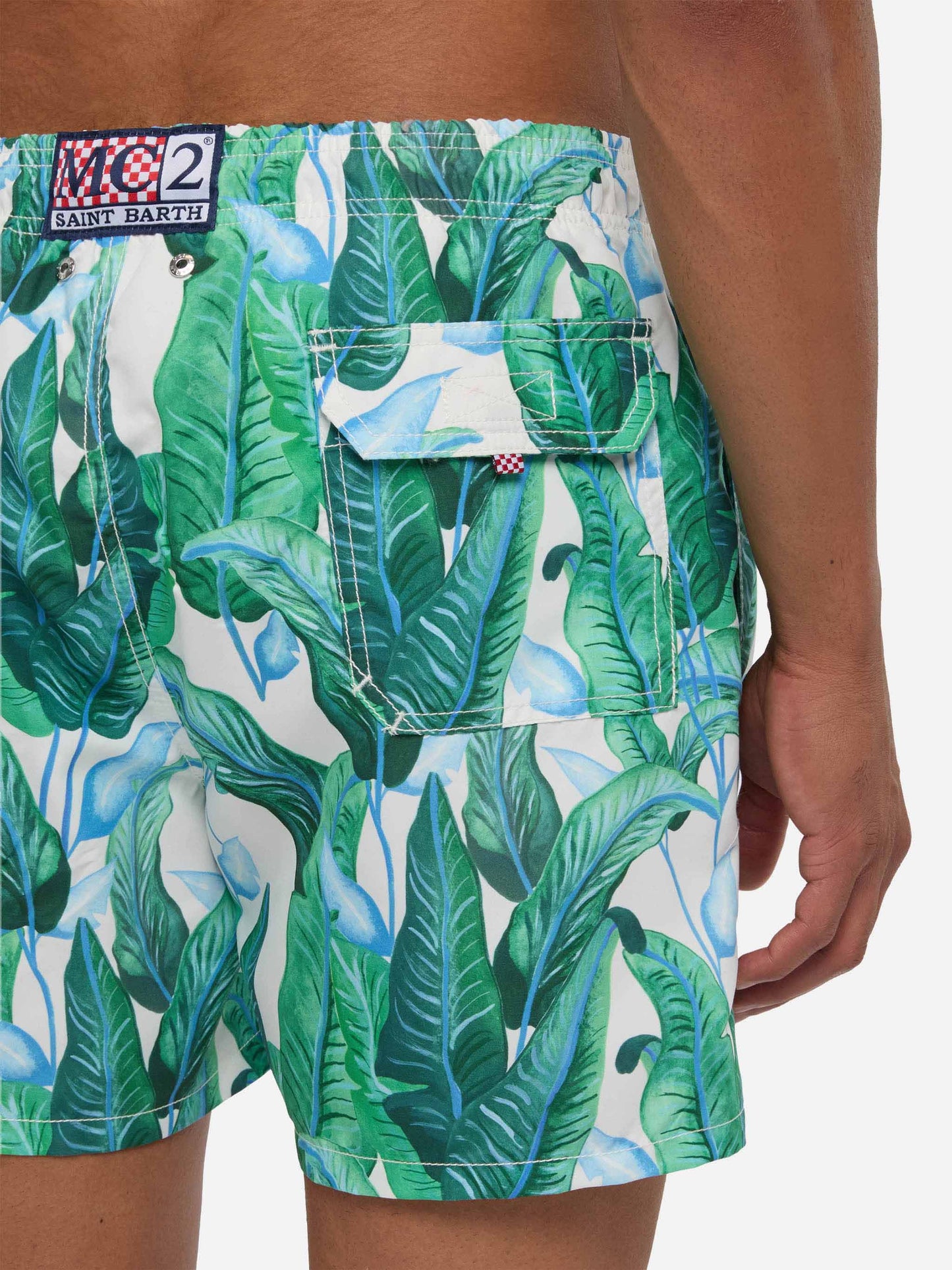 Tropical leaf print mid-length swim shorts