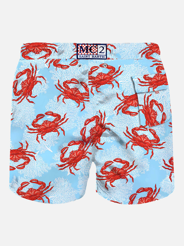 Light blue mid-length swim shorts with crab print