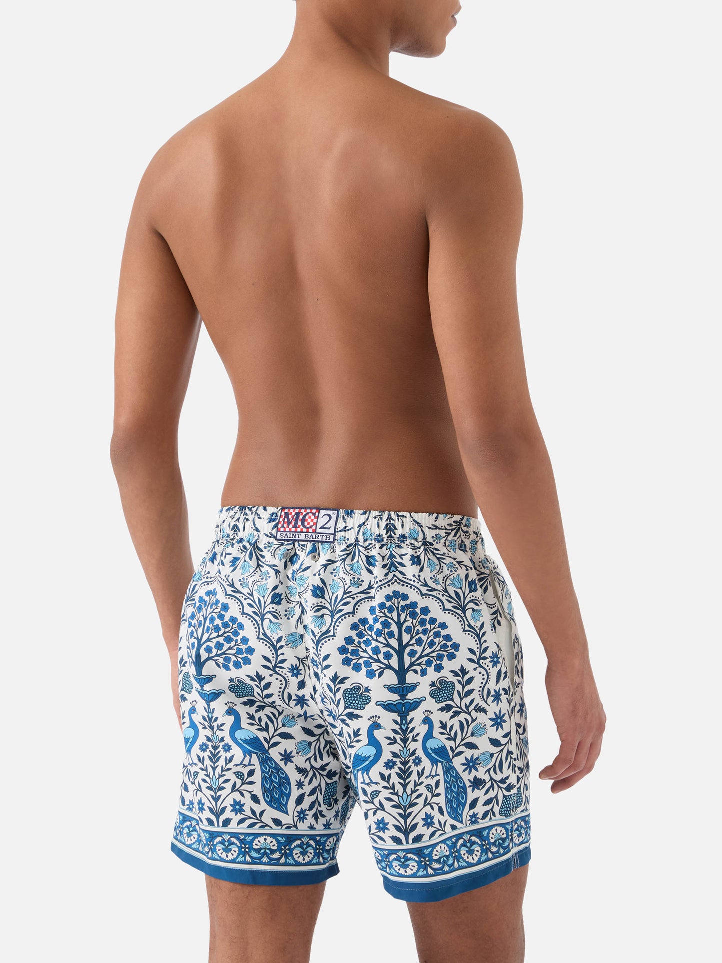 Gustavia white swim shorts with contrasting peacock print