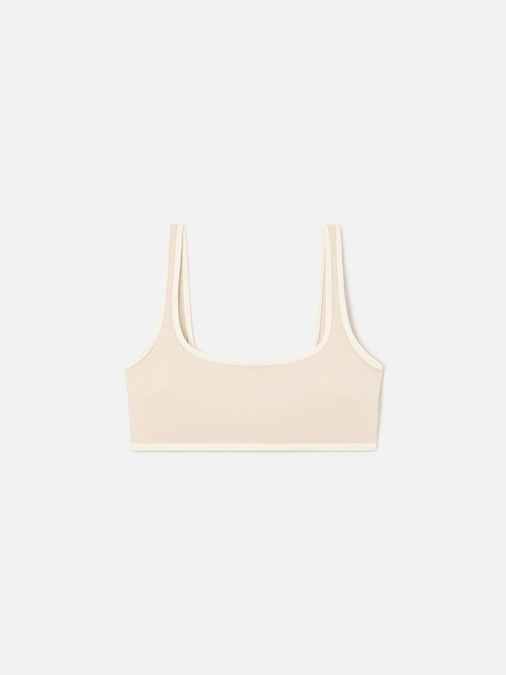 Top fitness Kassie beige con ribetes en contraste 
