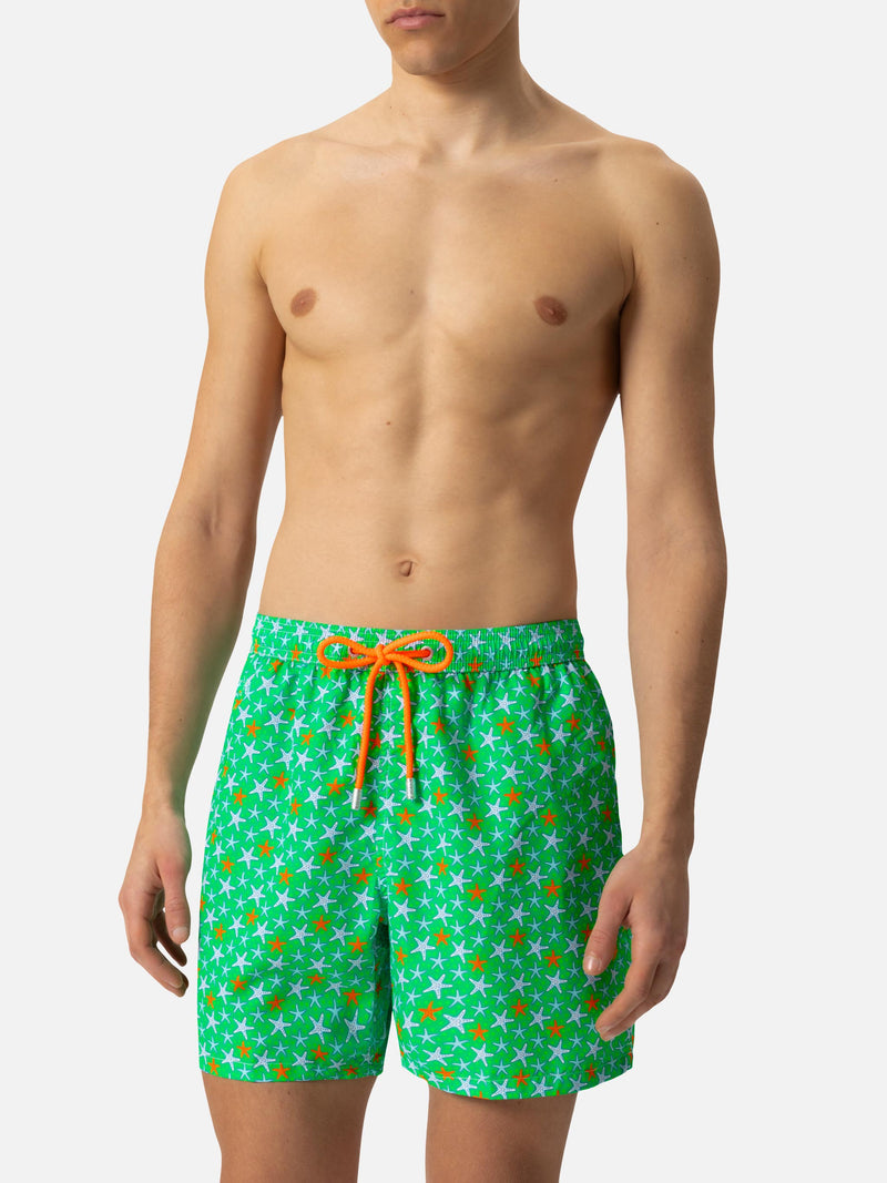 Man light fabric swim shorts with multicolor starfish print