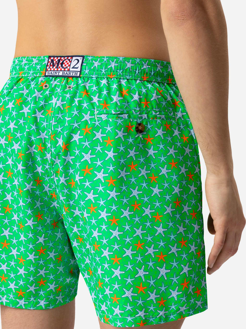 Man light fabric swim shorts with multicolor starfish print