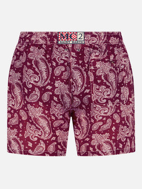 Man light fabric swim shorts with burgundy paisley print