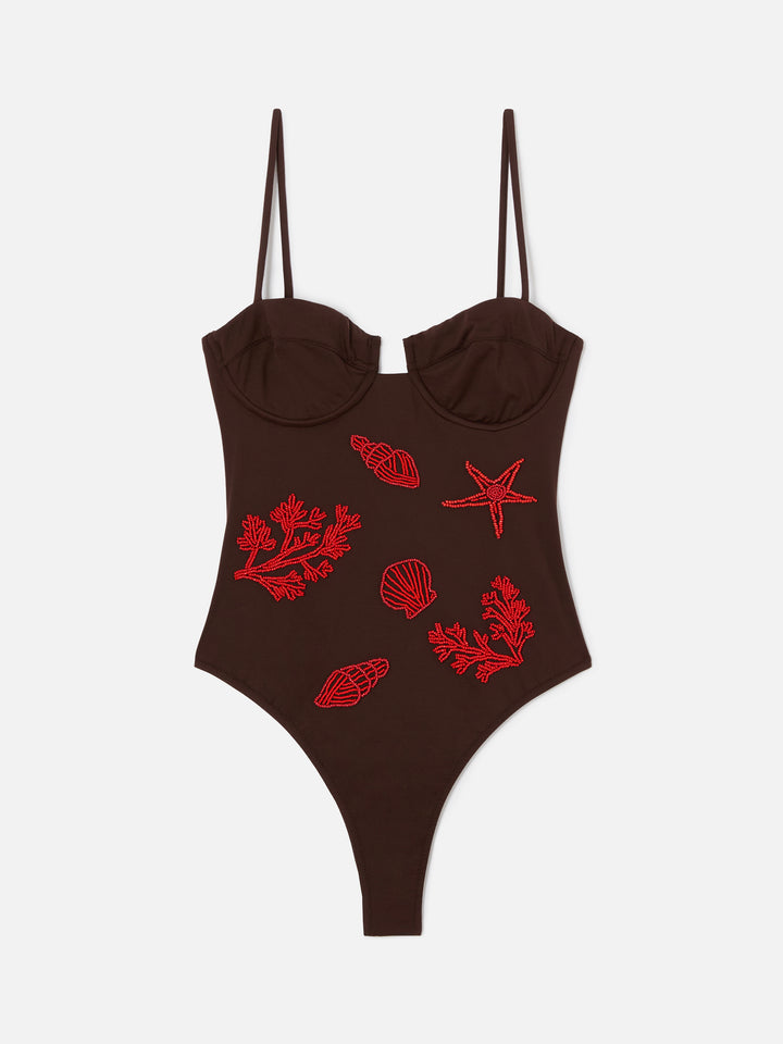 Medea one-piece swimsuit in brown with beaded sea-themed decorations