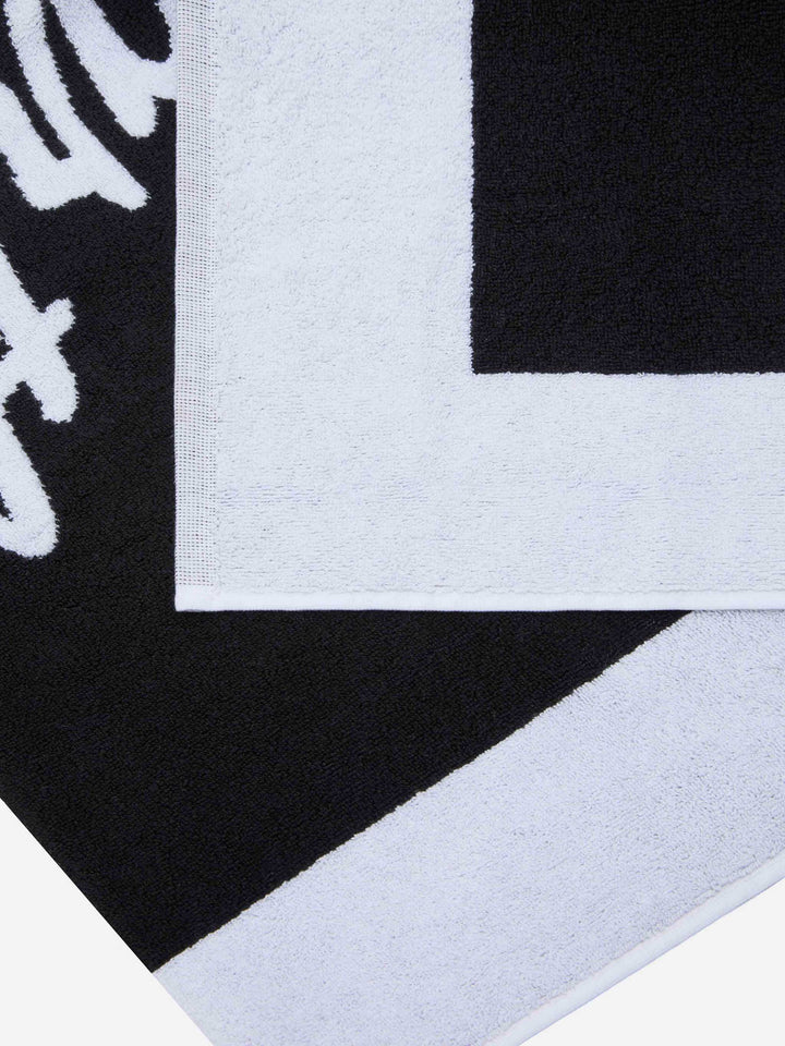 Telo mare nero in spugna con bordo bianco