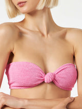 Woman pink crinkle bandeau top swimsuit with knot