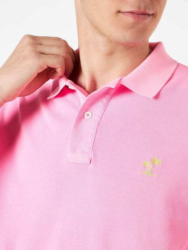 Polo in piquet rosa con logo St. Barth ed effetto vintage