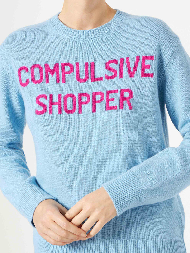 Woman crewneck light blue sweater with Compulsive Shopper print