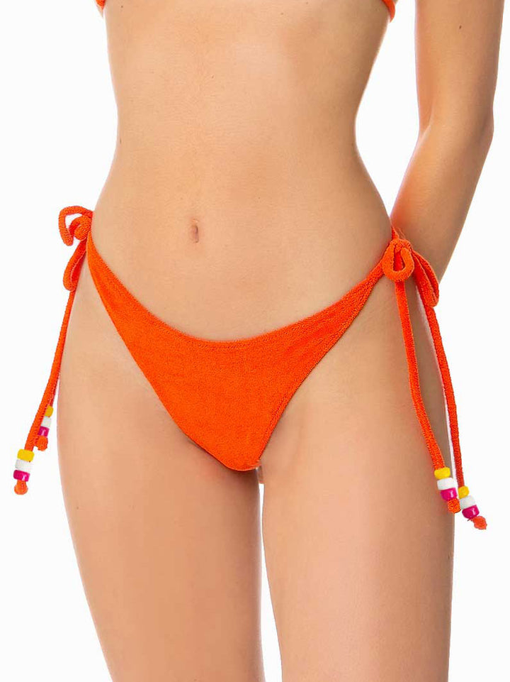Woman orange terry triangle bikini with charms