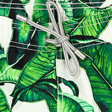 Mittellange Badeshorts mit Bananenblätter-Print