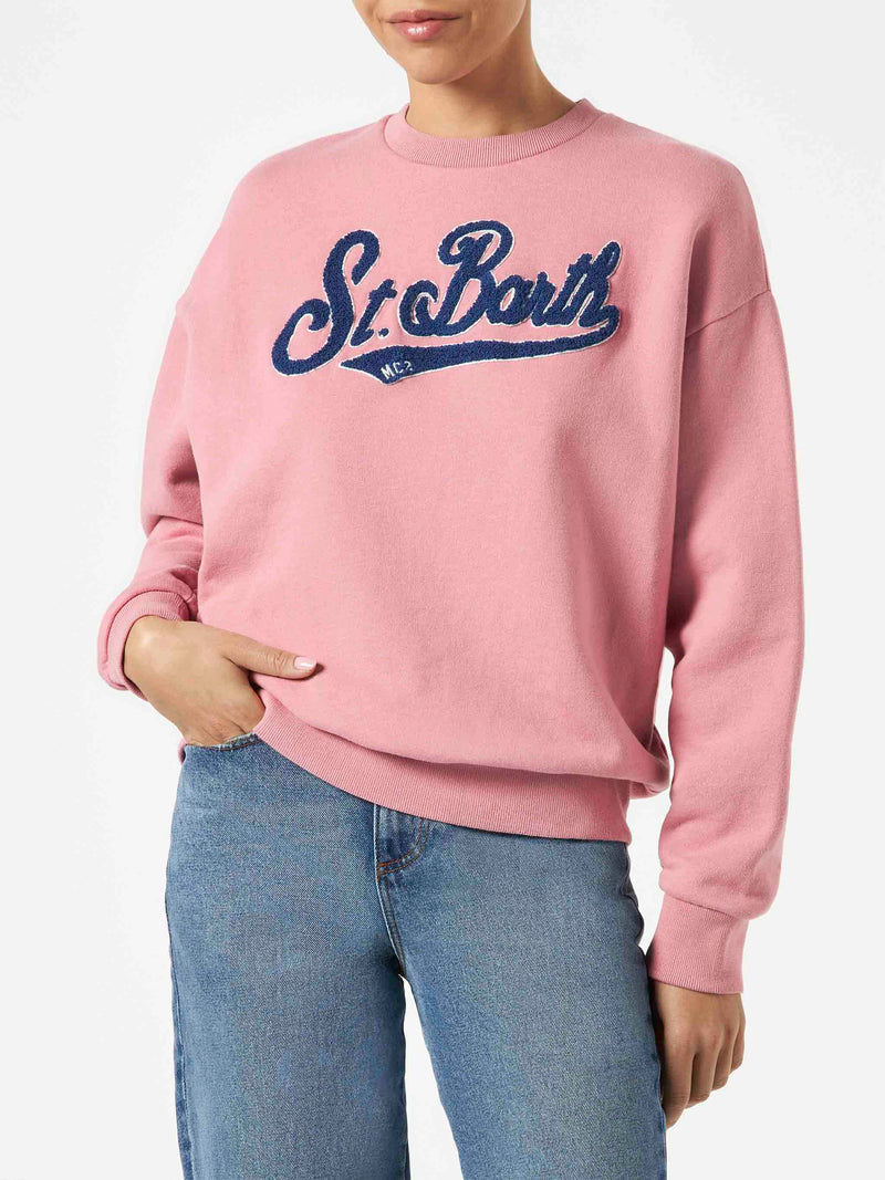 Woman pink fleece sweatshirt with terry logo