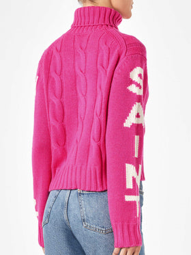 Woman fluo pink turtleneck braided sweater